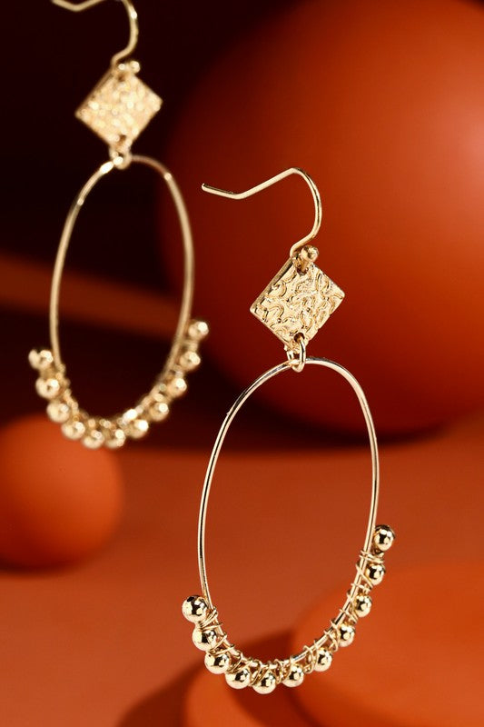 Gold decorative dangle hoop earrings